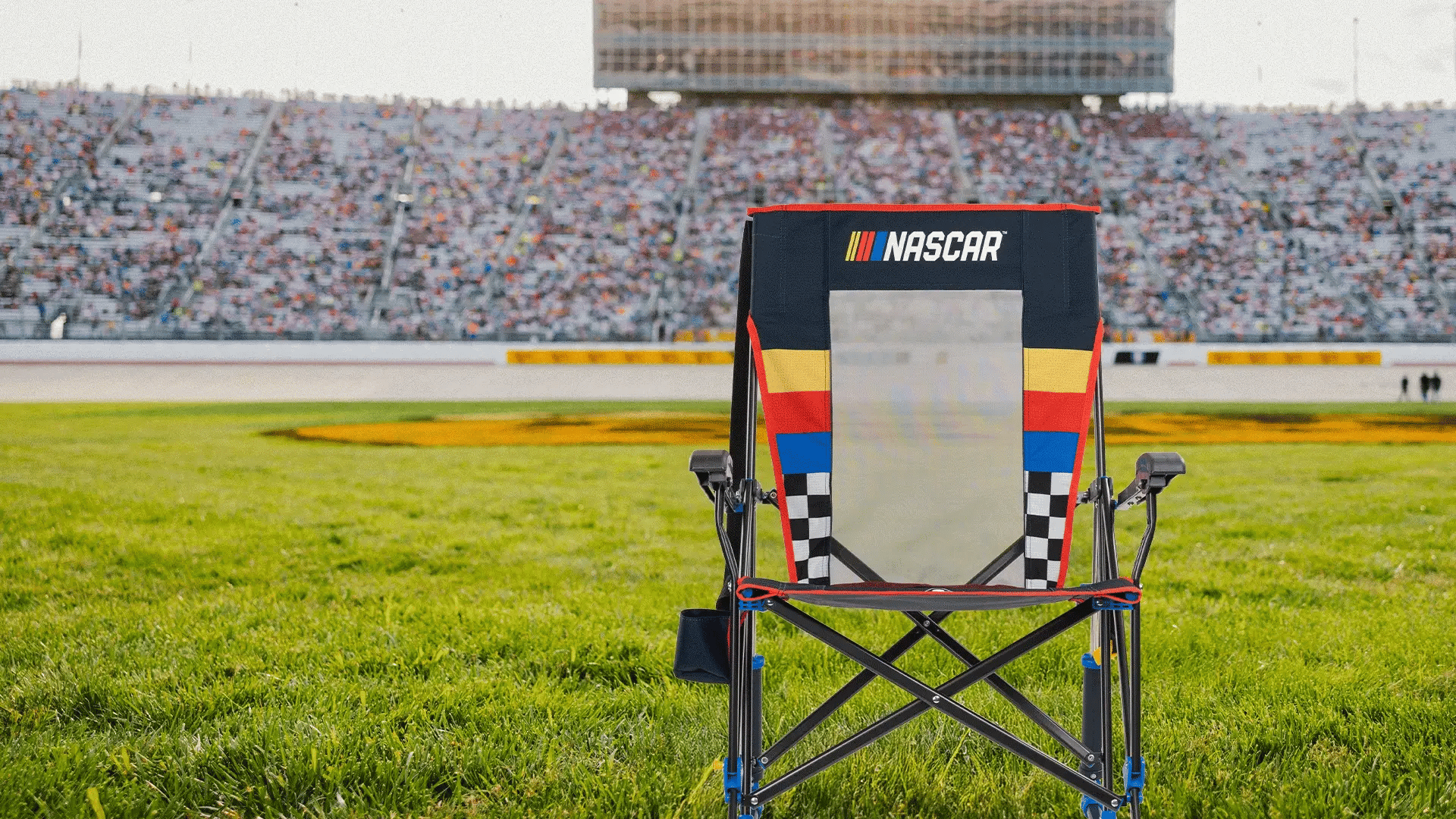 Different GCI chairs from the NASCAR collection in front of a racetrack.